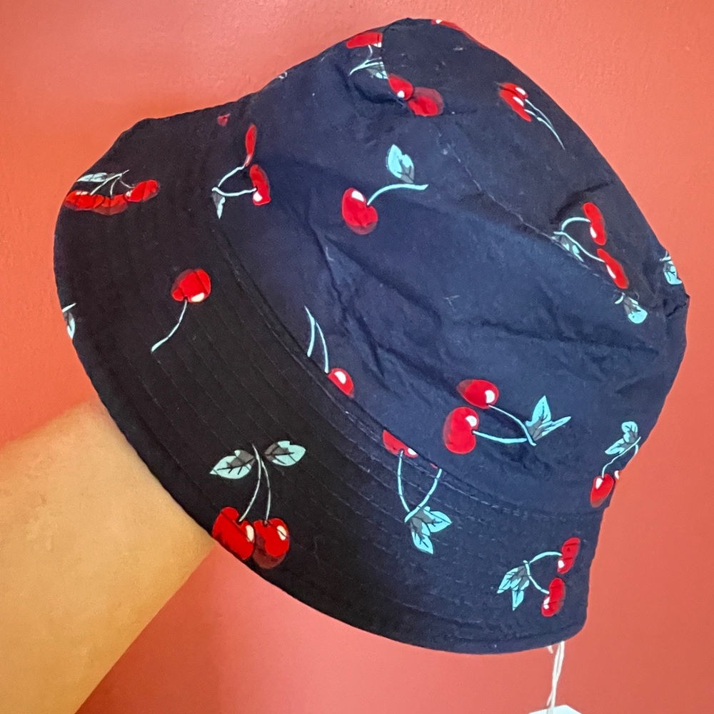 NWT cute hat brand new. Black with cherry print